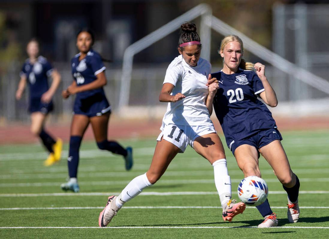 Galena midfielder Siena Ledesma (11) and Centennial forward Skyley Mecham (20) compete for the ...