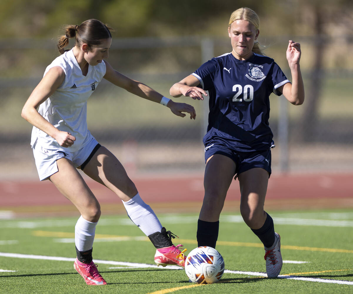 Galena midfielder Kennedy Hartley, left, and Centennial forward Skyley Mecham (20) compete for ...