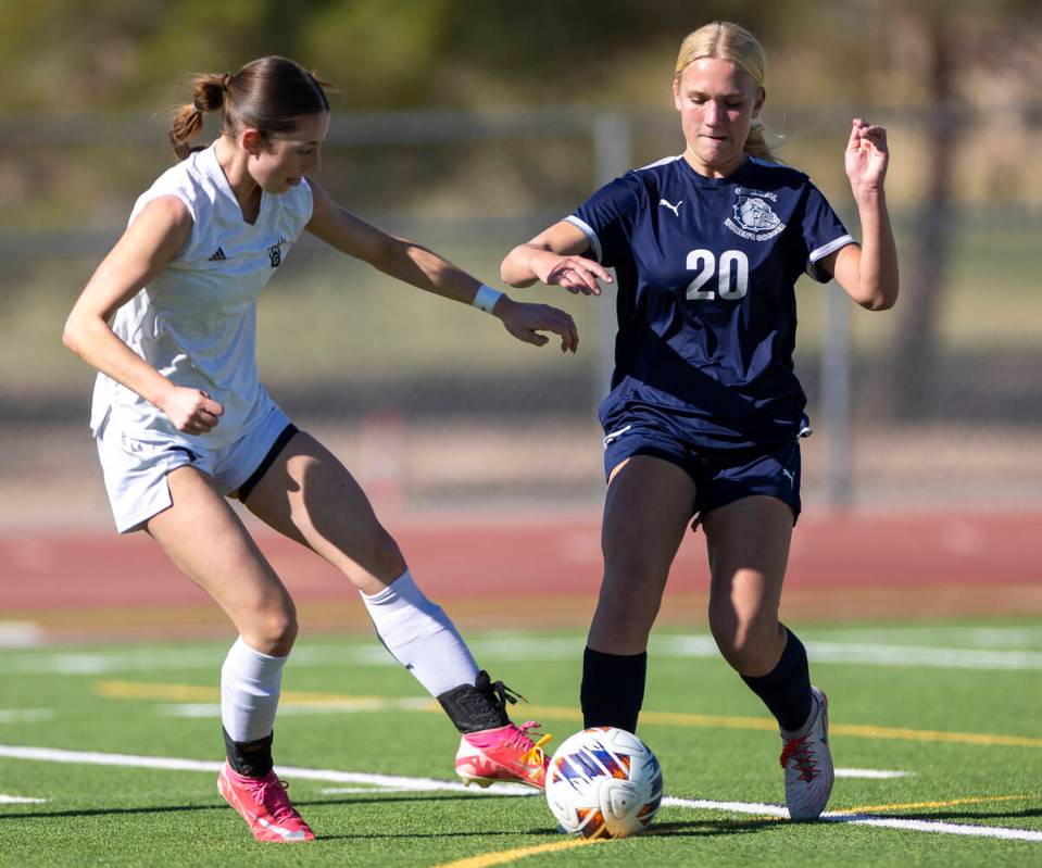 Galena midfielder Kennedy Hartley, left, and Centennial forward Skyley Mecham (20) compete for ...