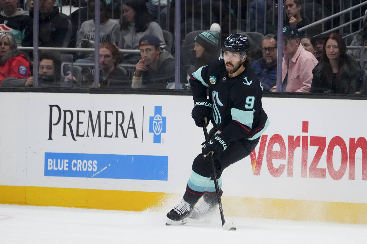 Seattle Kraken center Chandler Stephenson (9) moves the puck against the Winnipeg Jets during t ...