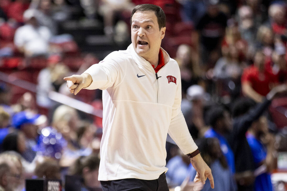 UNLV head coach Kevin Kruger yells toward the bench during the college basketball game against ...