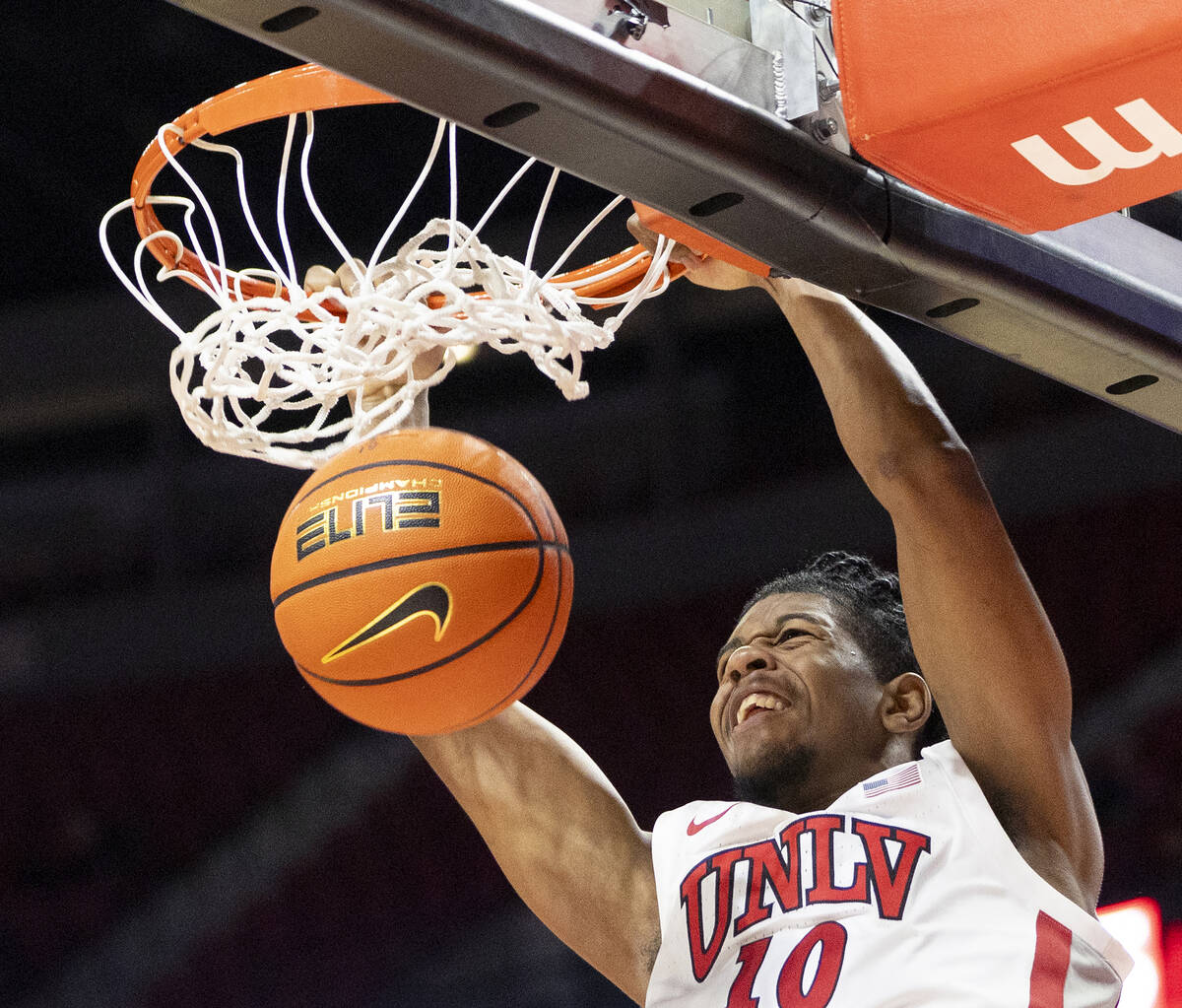 UNLV guard Jaden Henley (10) dunks the ball during the college basketball game against the Memp ...