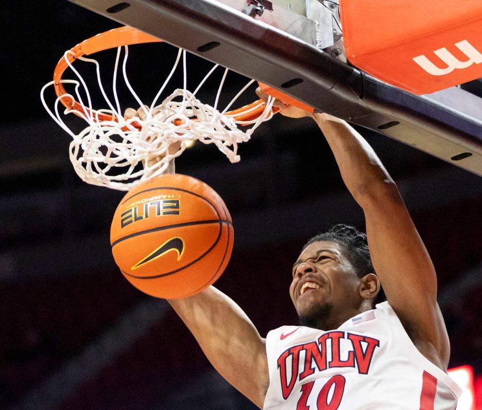 UNLV guard Jaden Henley (10) dunks the ball during the college basketball game against the Memp ...