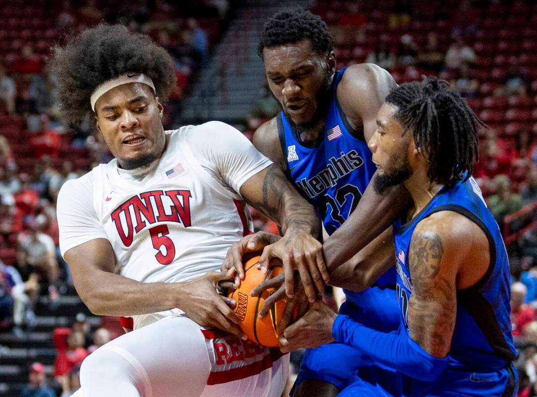 UNLV forward Rob Whaley Jr. (5), Memphis Tigers center Moussa Cisse (32) and Memphis Tigers gua ...