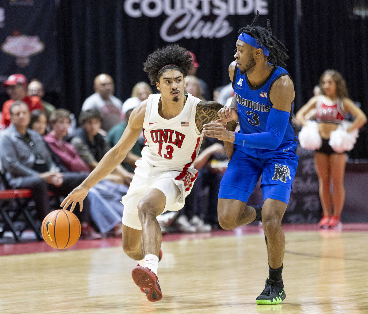 UNLV guard Brooklyn Hicks (13) and Memphis Tigers guard Colby Rogers (3) compete during the col ...