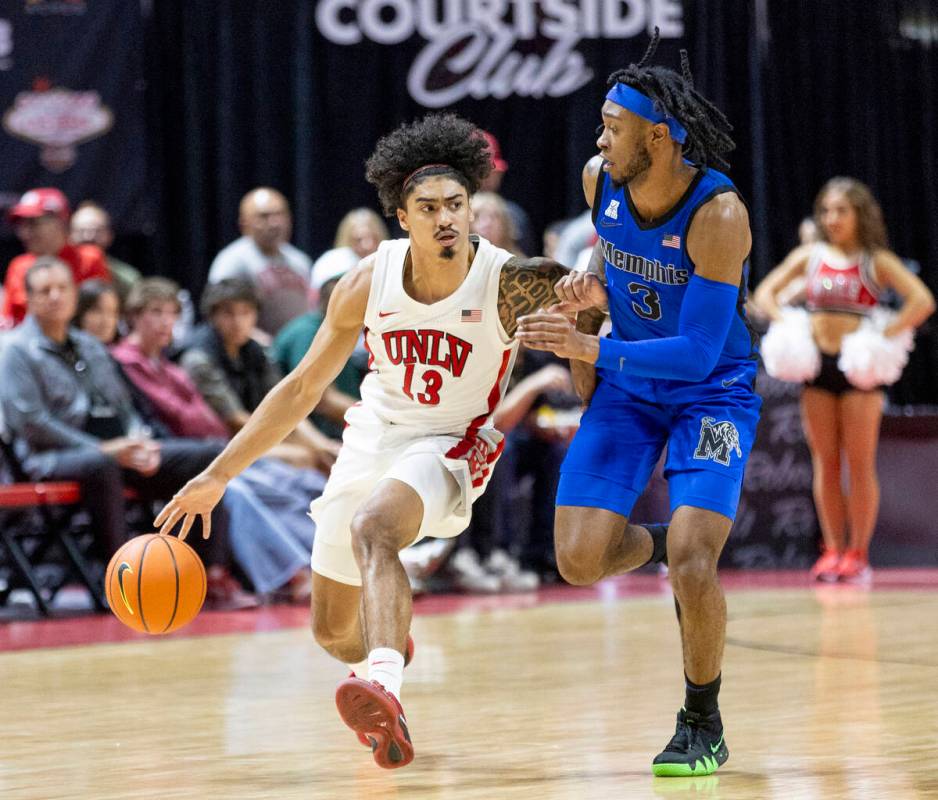 UNLV guard Brooklyn Hicks (13) and Memphis Tigers guard Colby Rogers (3) compete during the col ...