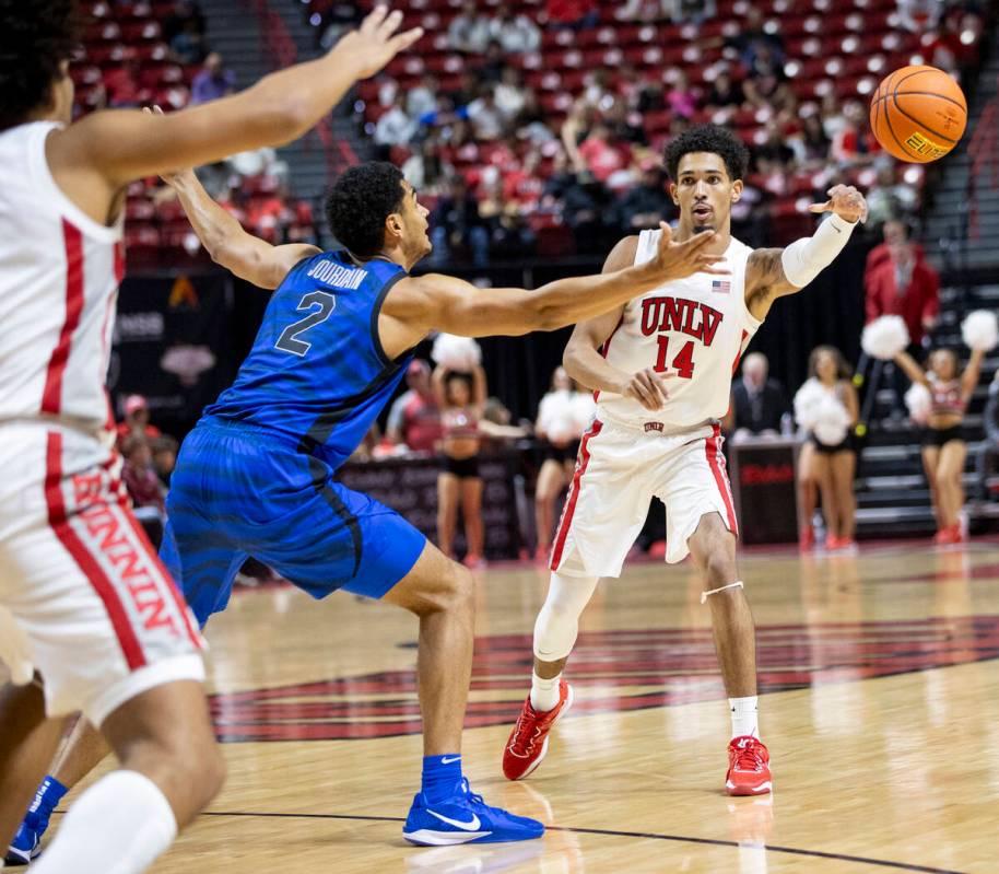 UNLV guard Jailen Bedford (14) passes the ball during the college basketball game against the M ...