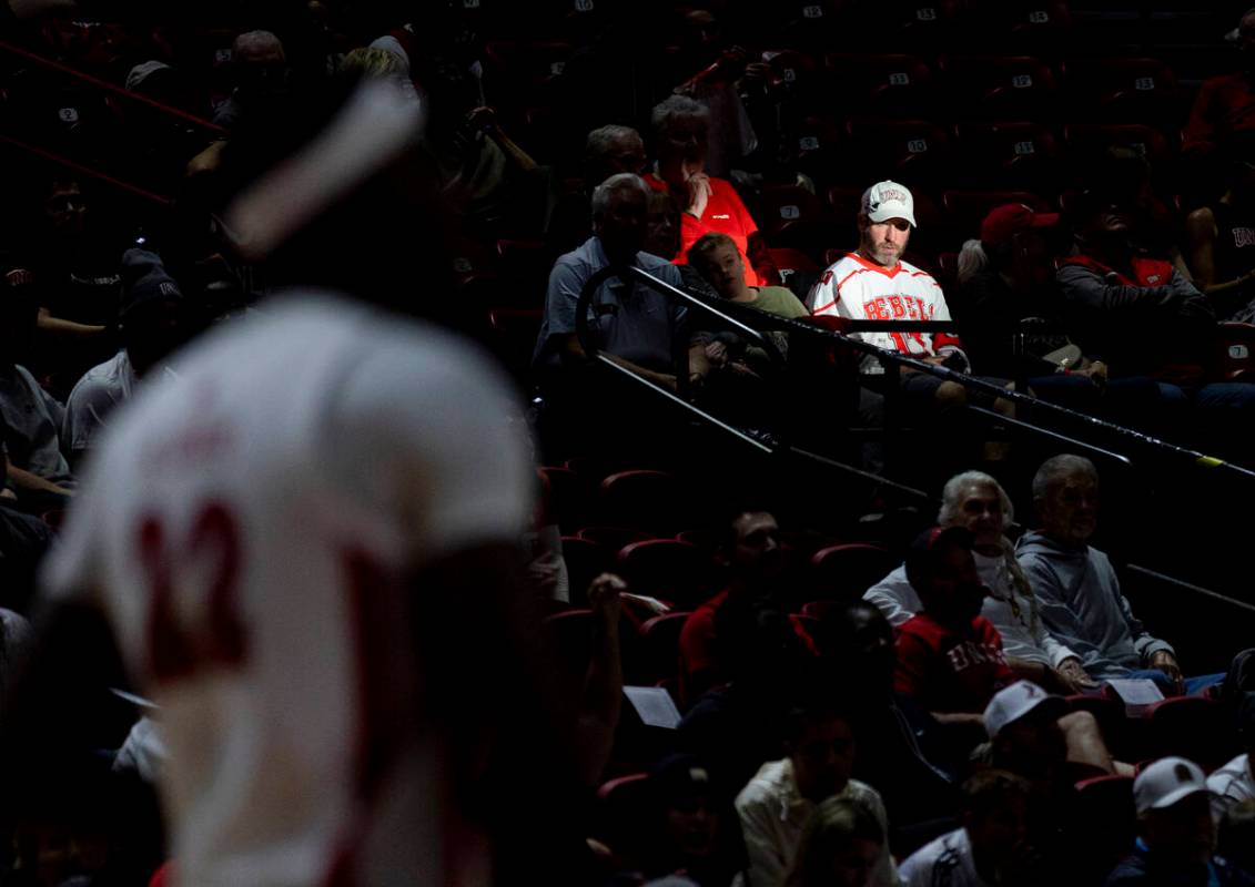 A UNLV fan watches the game during the college basketball game against the Memphis Tigers at th ...