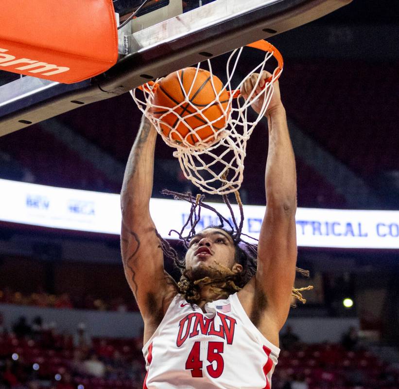 UNLV forward Jeremiah Cherry (45) dunks the ball during the college basketball game against the ...