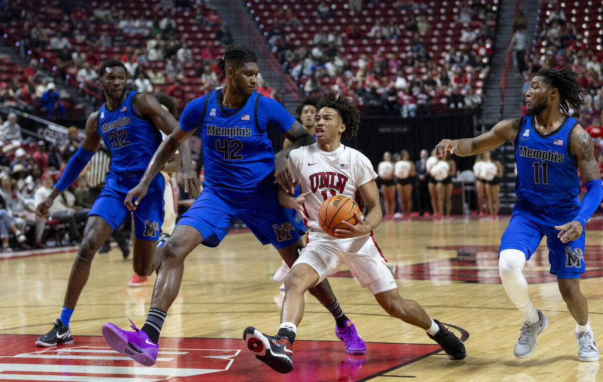 UNLV guard Dedan Thomas Jr. (11) rushes the paint during the college basketball game against th ...