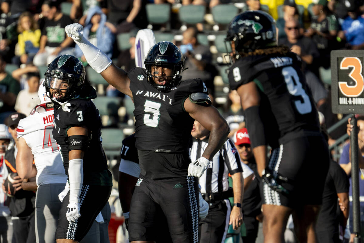 Hawaii defensive lineman Tariq Jones (5) celebrates after a play during the first half of an NC ...