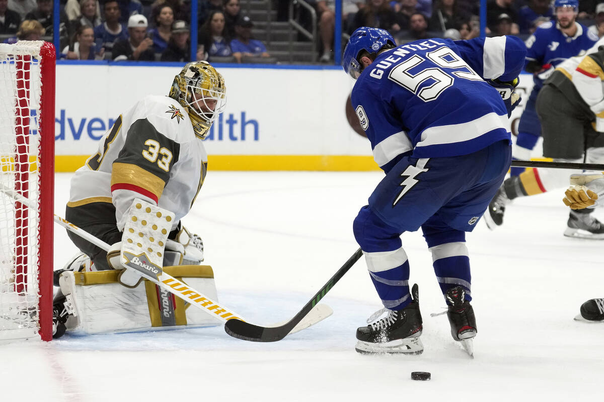 Vegas Golden Knights goaltender Adin Hill (33) makes a save on a shot by Tampa Bay Lightning ce ...