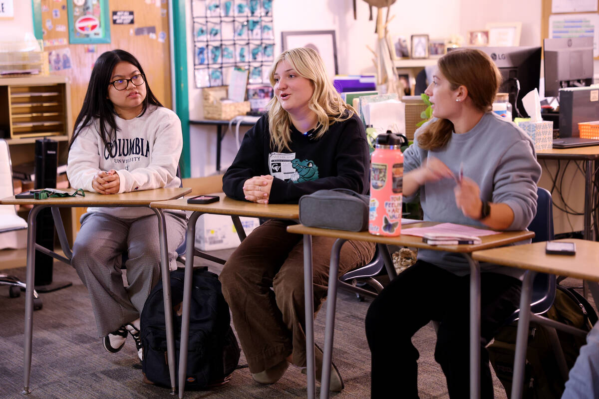 The InvestiGator Co-Editor-in-Chief Kinsley Priebe, center, talks during a meeting about the up ...