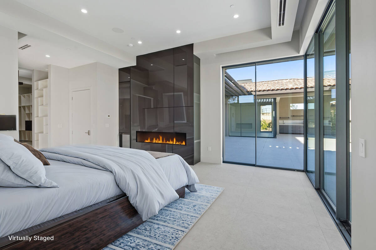 This bedroom comes complete with a fireplace. (Dayton Hammond Real Value Media)