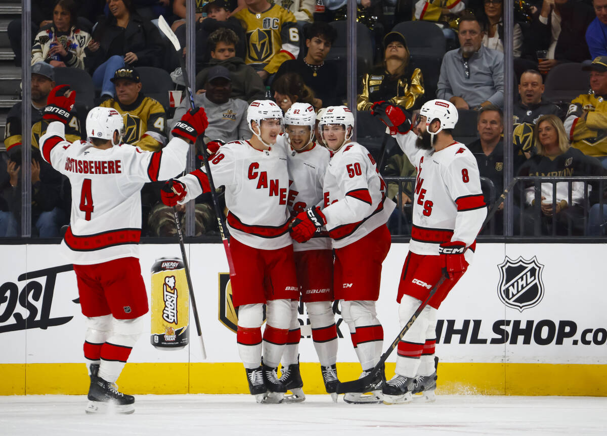 The Carolina Hurricanes celebrate their second goal against the Golden Knights during the first ...