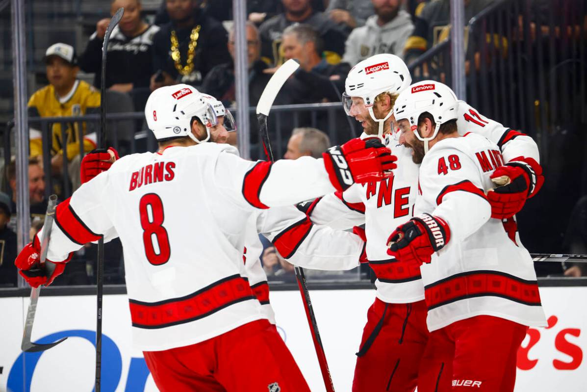 The Carolina Hurricanes celebrate after scoring against the Golden Knights during the second pe ...