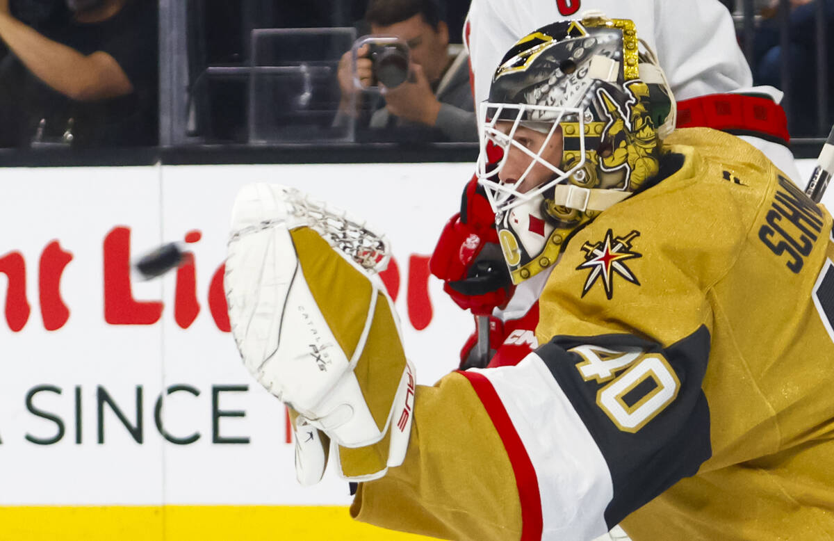 Golden Knights goaltender Akira Schmid (40) stops the puck against the Carolina Hurricanes duri ...