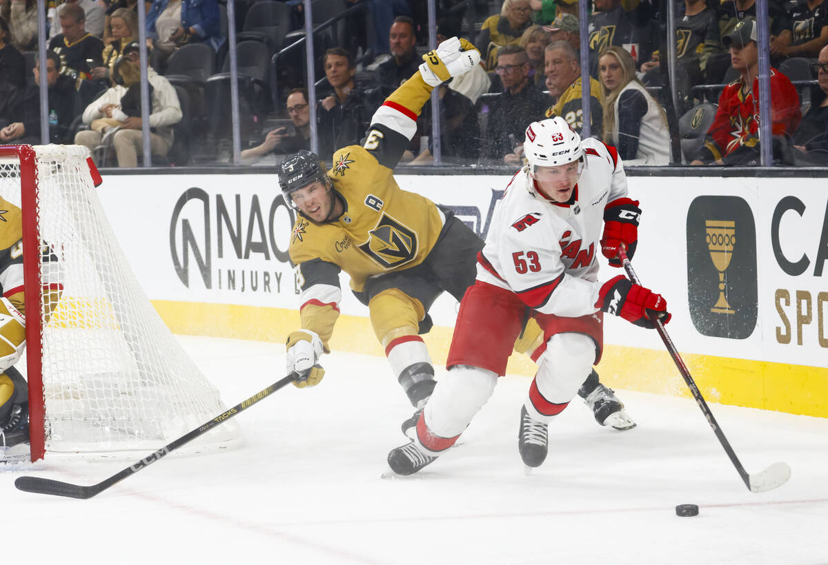 Carolina Hurricanes right wing Jackson Blake (53) skates with the puck under pressure from Gold ...