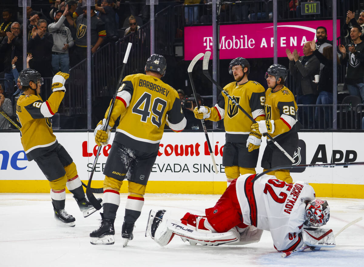 The Golden Knights celebrate after a goal against the Carolina Hurricanes during the third peri ...