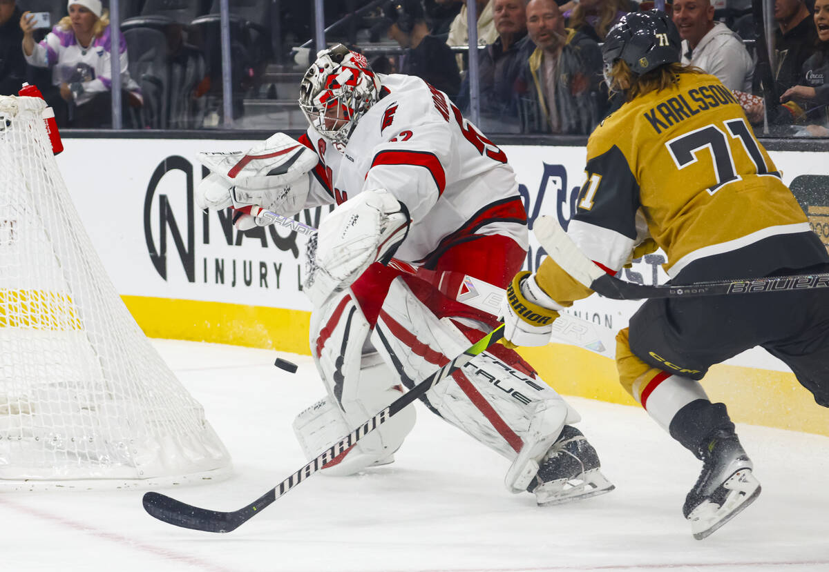 Carolina Hurricanes goaltender Pyotr Kochetkov (52) tries to save the puck outside of the creas ...