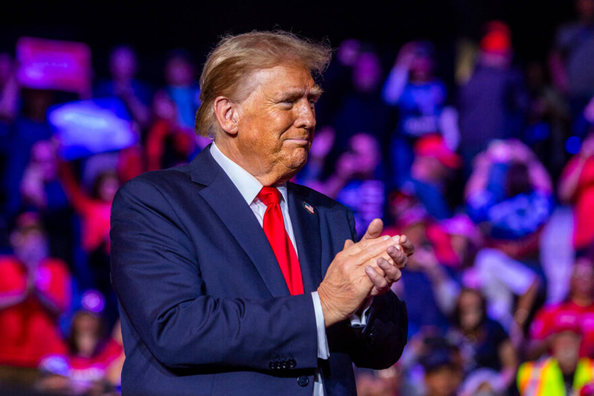 President-elect Donald Trump looks to his supporters after speaking during a rally at the Lee's ...