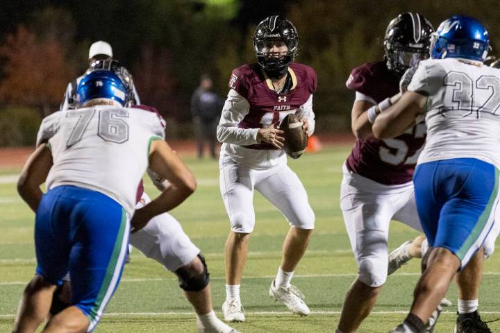 Faith Lutheran senior Alexander Rogers (15) looks to throw the ball during the 5A Division II S ...