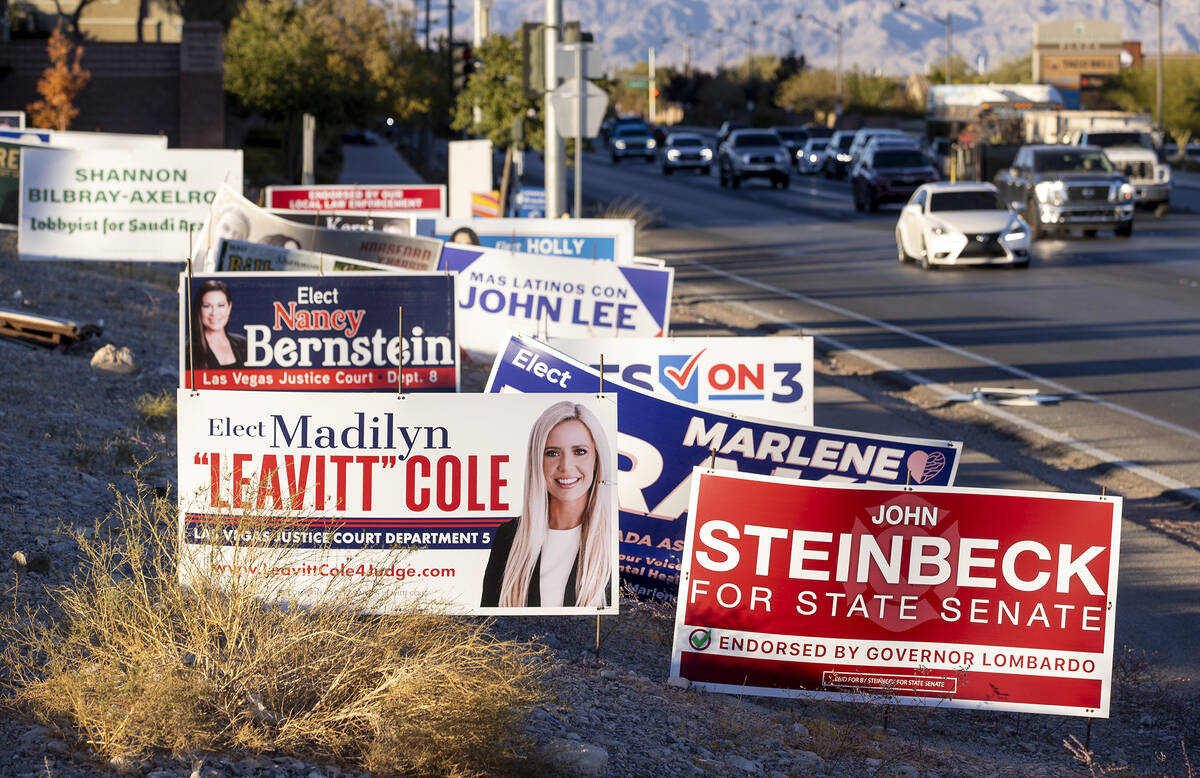 Campaign signs sit along North Hualapai Way a week after elections, Tuesday, Nov. 12, 2024, in ...