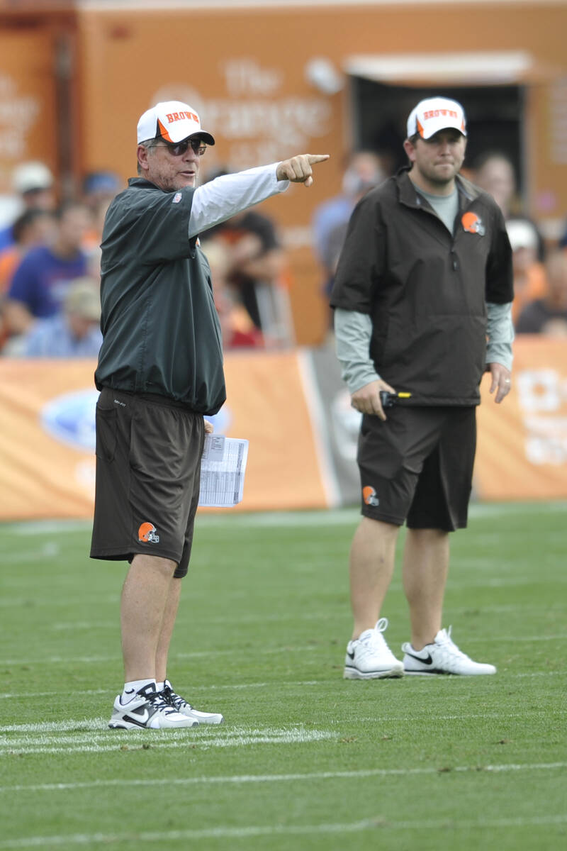 Cleveland Browns offensive coordinator Norv Turner, left, and wide receivers coach Scott Turner ...