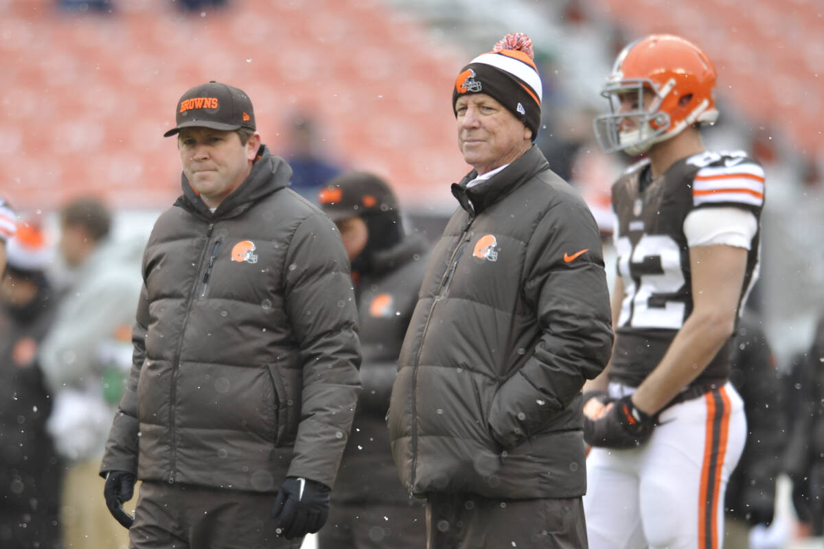 Cleveland Browns wide receivers coach Scott Turner, and offensive coach Norv Turner stand on th ...