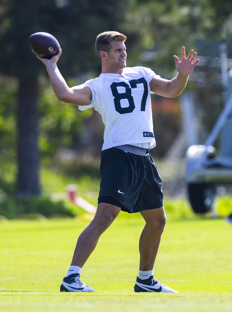 Raiders tight end Michael Mayer (87) tosses a ball in warmups during the first day of Raiders t ...