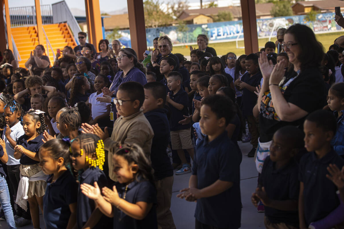 Students cheer as Pre-K teacher Leigh Todd, not pictured, of Tate Elementary School is named ea ...