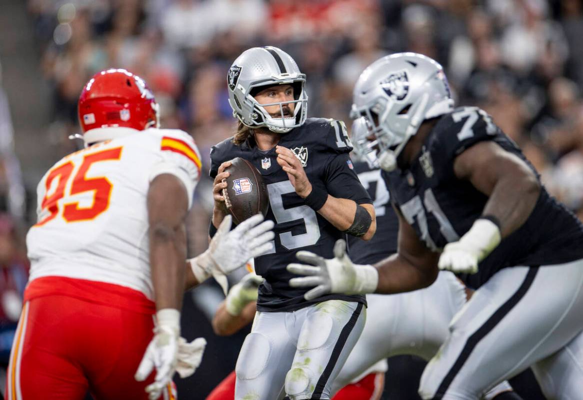 Raiders quarterback Gardner Minshew (15) looks to throw the ball during the second half of the ...