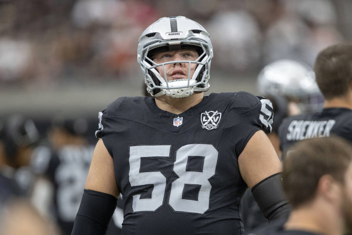 Raiders guard Jackson Powers-Johnson (58) on the sideline before an NFL game against the Kansas ...