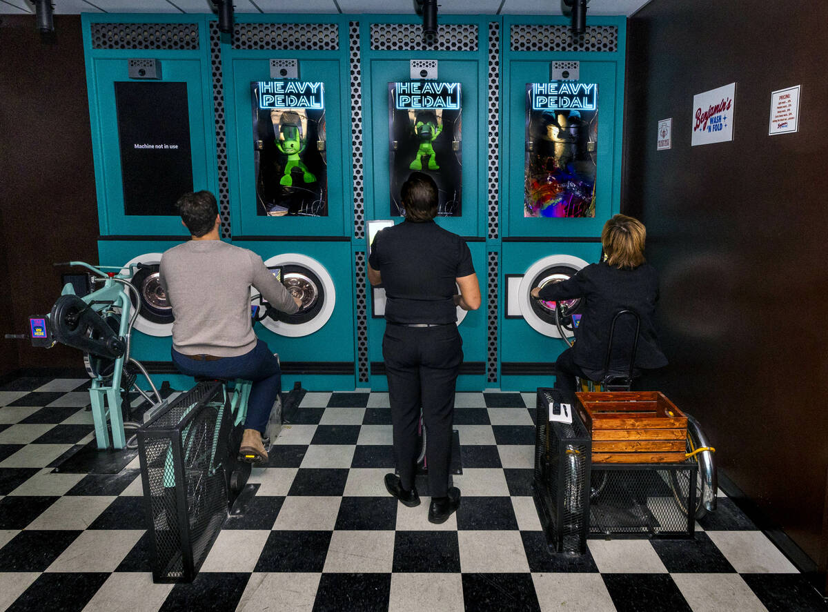 Visitors pedal to meet a challenge in the Heavy Pedal Laundromat at Dopeameme, a new attraction ...