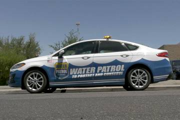 A Las Vegas Valley Water District water patrol car on a Henderson street as part of a water was ...