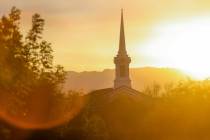 FILE - The sun sets behind The Church of Jesus Christ of Latter-day Saints on Friday, Aug. 23, ...