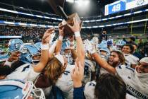 Centennial players celebrate a state championship win over Sunrise Mountain during a class 4A s ...