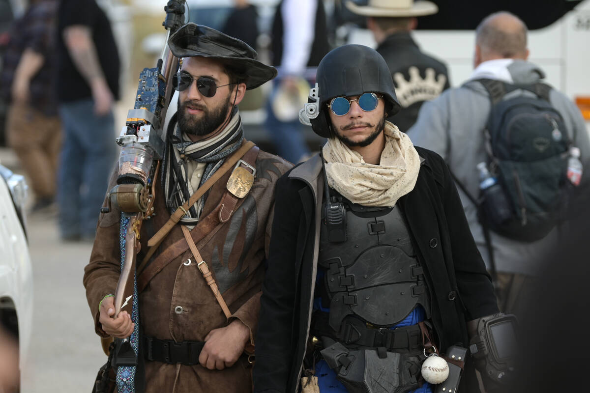 Attendees in homemade costumes walk through Goodsprings during the Fallout Fan Celebration Satu ...