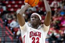 UNLV forward Pape N'Diaye (22) looks to shoot the ball during the college basketball game again ...