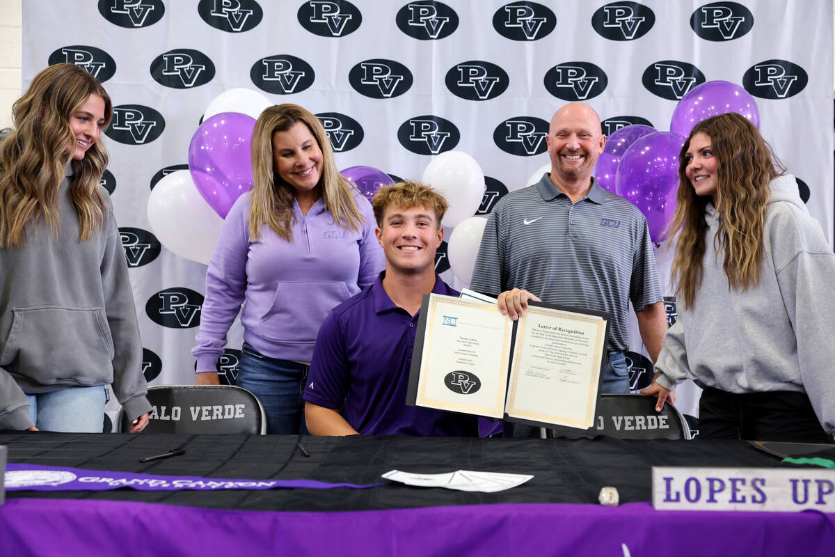 Palo Verde baseball player Tanner Johns shows his signed financial aid agreements for Grand Can ...