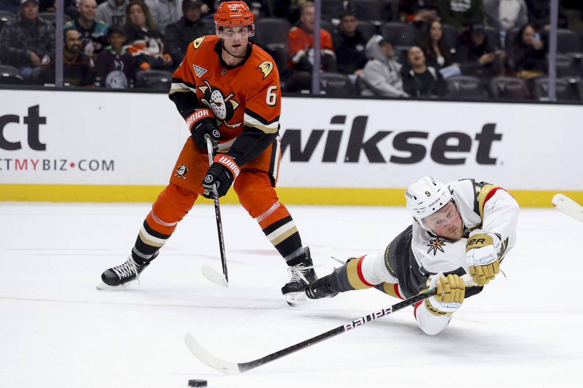 Vegas Golden Knights center Jack Eichel, right, shoots against Anaheim Ducks defenseman Brian D ...