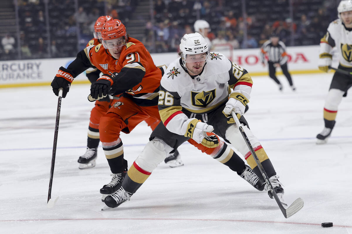 Vegas Golden Knights right wing Alexander Holtz, right, and Anaheim Ducks center Leo Carlsson v ...