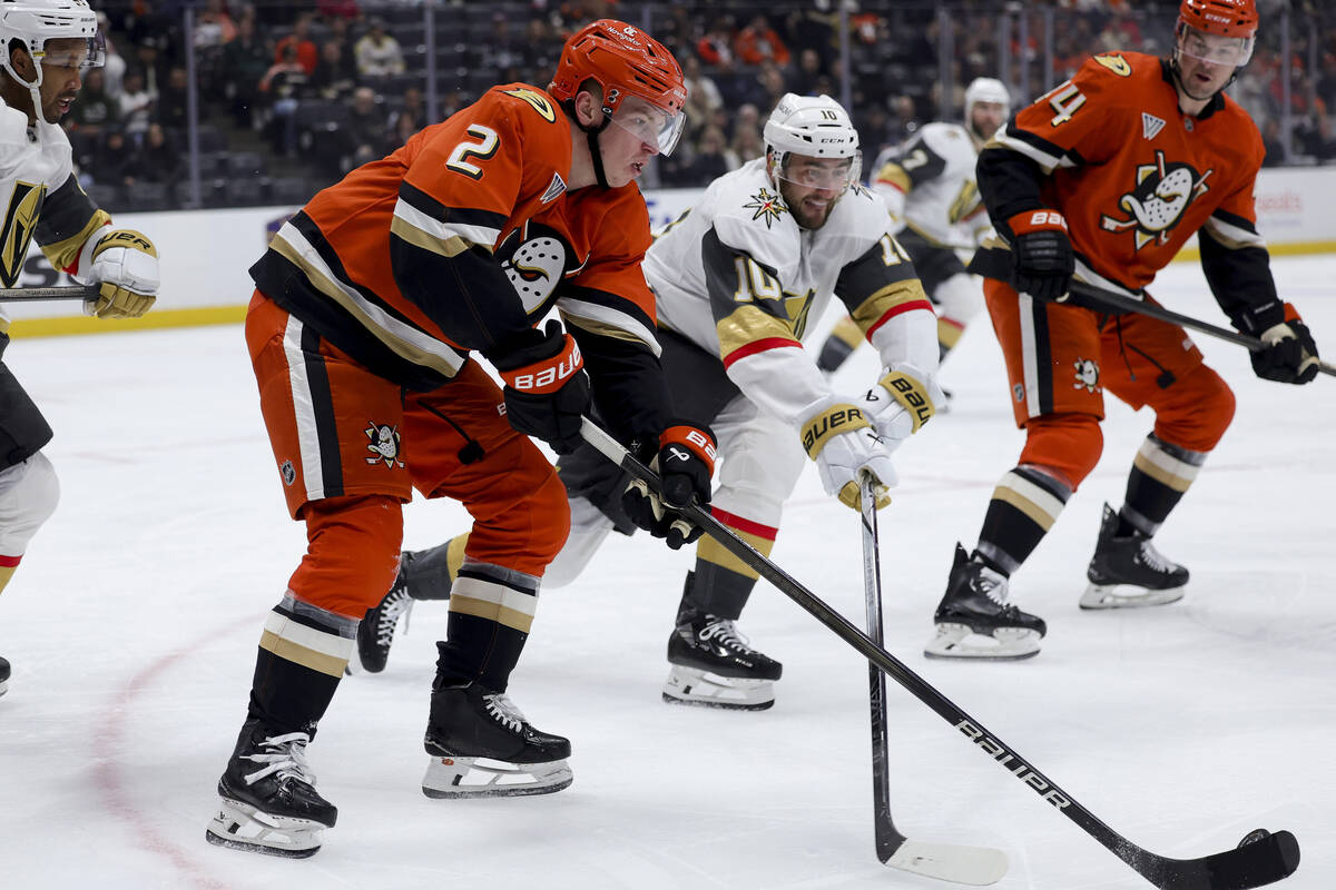 Anaheim Ducks defenseman Jackson LaCombe (2) controls the puck against Vegas Golden Knights cen ...