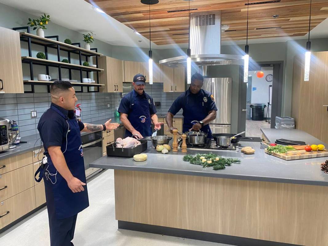 Members of the Clark County Fire Department demonstrate how to stay safe while cooking a holida ...