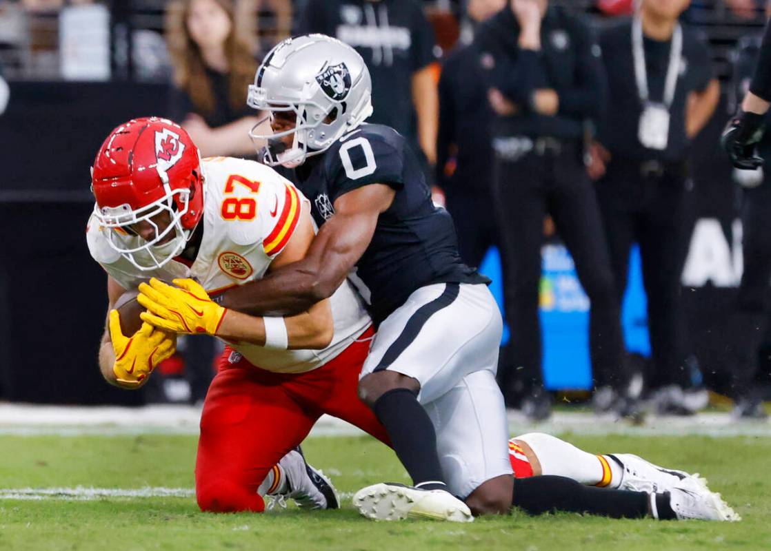 Kansas City Chiefs tight end Travis Kelce (87) is taken down by Raiders cornerback Jakorian Ben ...