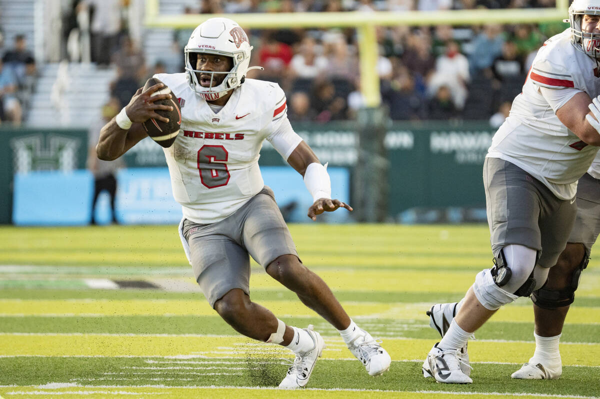 UNLV defensive back Jeremiah Vessel (6) runs the ball during the first half of an NCAA college ...