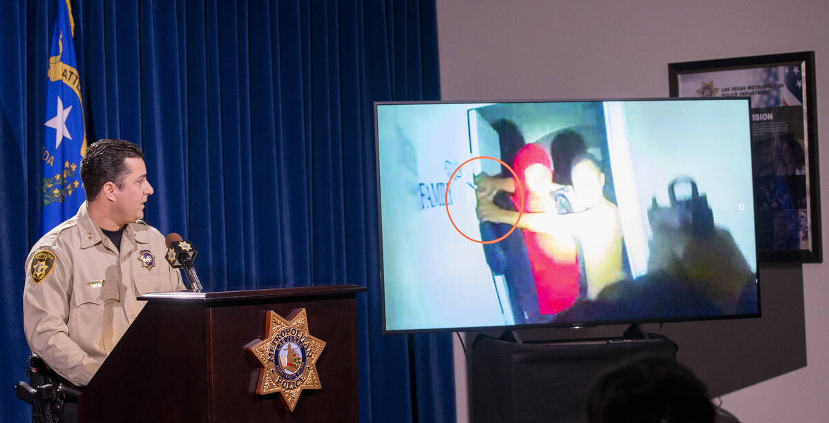 Metropolitan Police Department Assistant Sheriff Dori Koren speaks as a frame from body camera ...