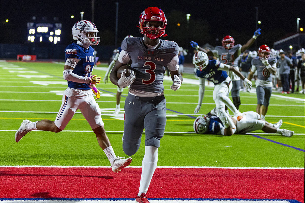 Arbor View wide receiver Damani Warren (3) eases into the end zone against Liberty defenders du ...