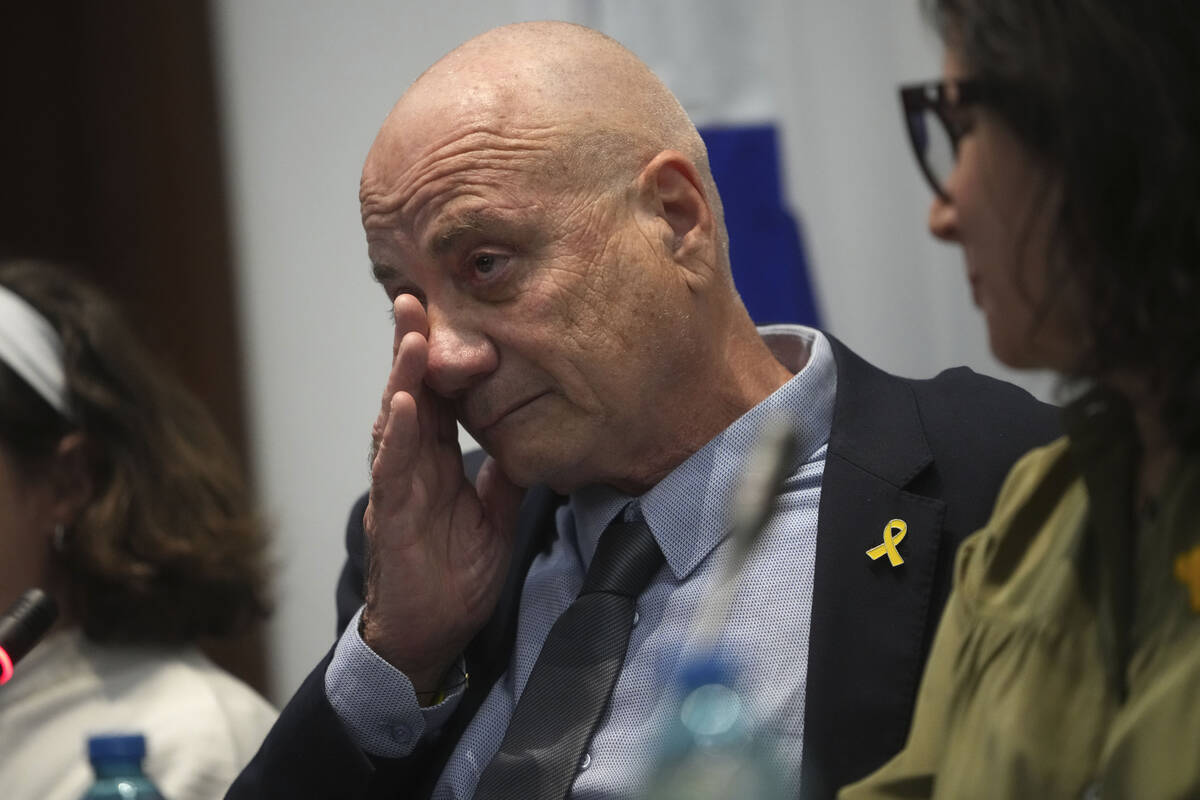 Louis Har, a former Israeli hostage, gets emotional during a press conference in Rome, Thursday ...