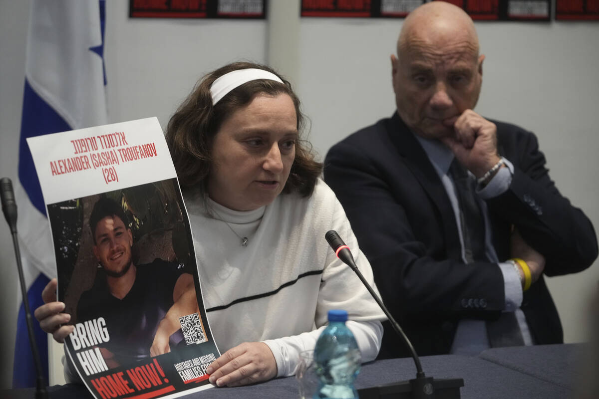 Elena Troufanov, left, and Louis Har, former Israeli hostages and relatives of some still being ...